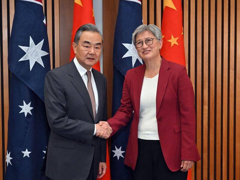 China's Foreign Minister Wang Yi is preparing for business discussions after talks with Penny Wong. (Mick Tsikas/AAP PHOTOS)