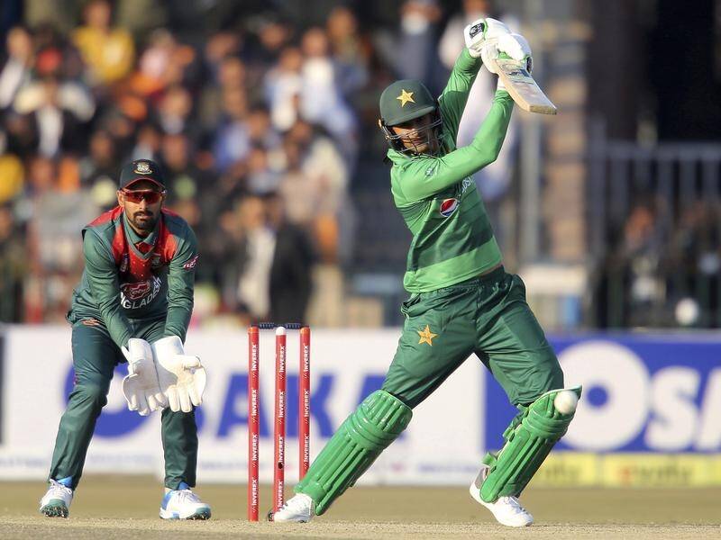 Pakistan's Shoaib Malik cracked 58 not out in his side's five-wicket T20 win over Bangladesh.