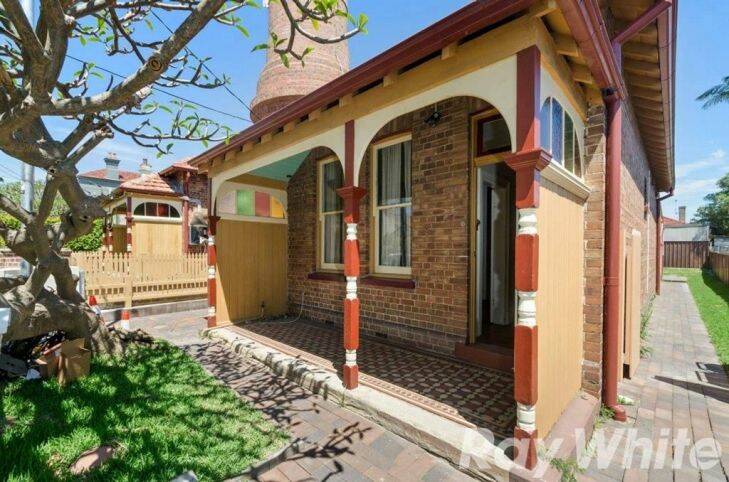 Historic Marrickville cottages with towering sewer vent on the market