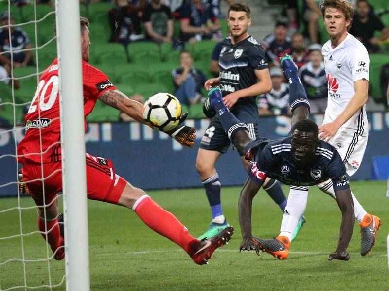 A Kenjok Athiu header has sealed a 2-1 A-League win for the Melbourne Victory over Wellington.