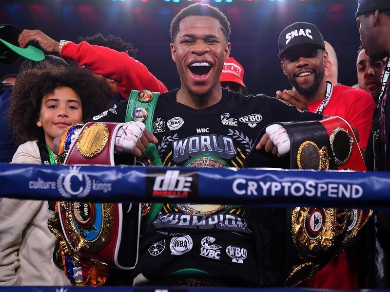 Devin Haney with his four belts after defeating George Kambosos Jnr on Sunday