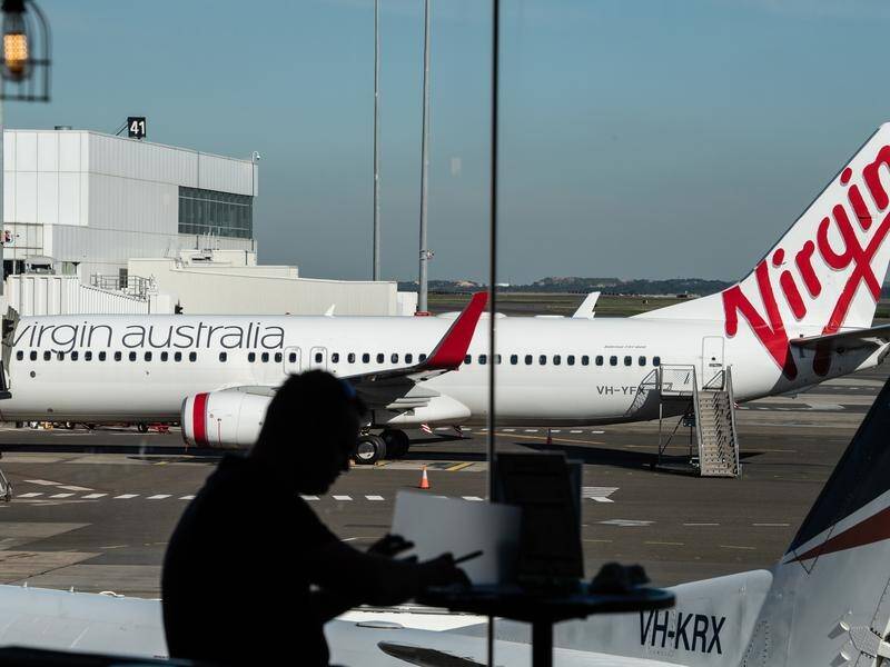 Virgin Australia has been sold to Bain Capital a day after Qantas said it would cut 6000 jobs.