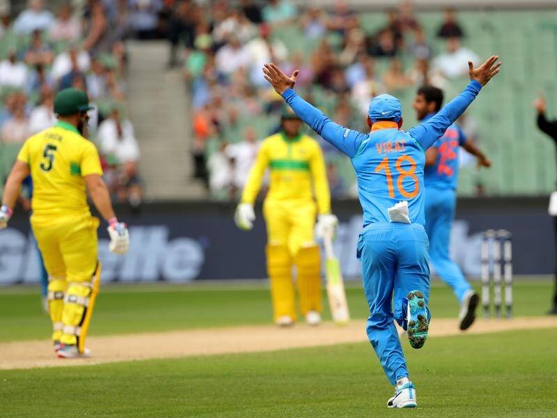 India celebrates the wicket of Australian captain Aaron Finch at the MCG.