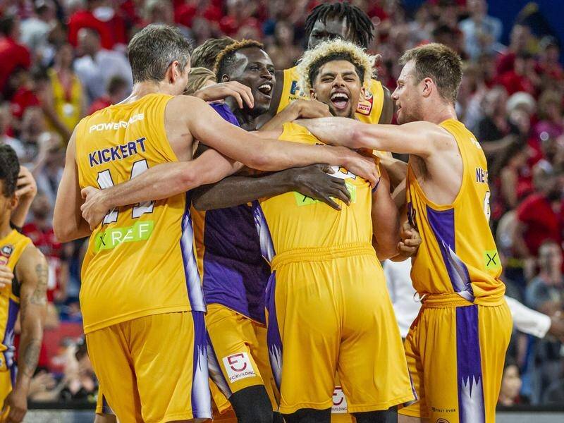 The Sydney Kings have claimed an unlikely NBL victory in Perth thanks to a David Wear three-pointer.