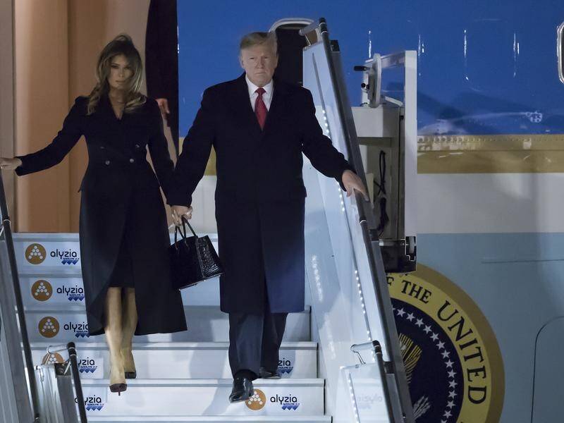 The Trumps landed at Orly airport, where they were received by the US Ambassador to France.
