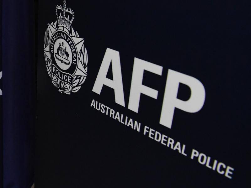 Union officials say a decision by the AFP to ban the use of spit hoods will put officers at risk. (James Ross/AAP PHOTOS)