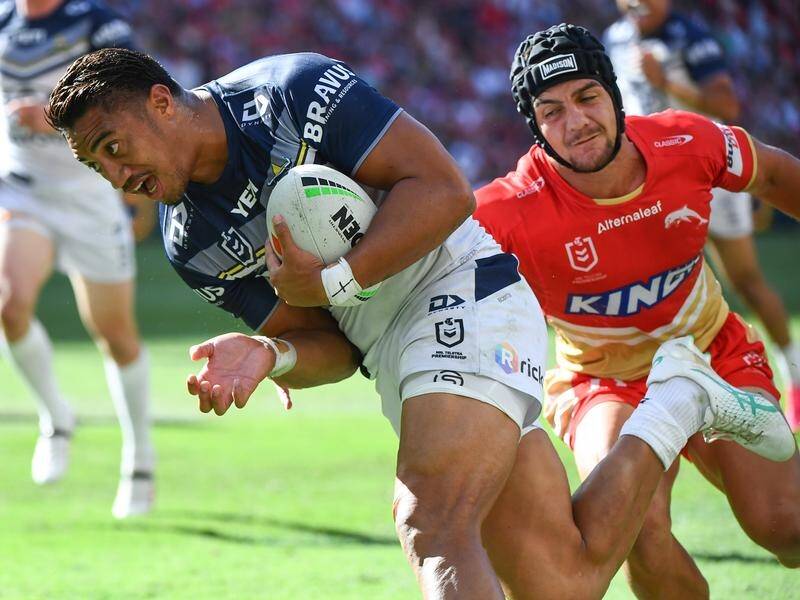 Murray Taulagi powers through to score a try during the Cowboys' 43-18 hammering of the Dolphins. (Jono Searle/AAP PHOTOS)