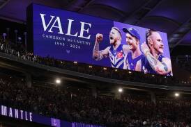 The Dockers paid tribute at Optus Stadium to former Fremantle and GWS player Cam McCarthy. (Richard Wainwright/AAP PHOTOS)