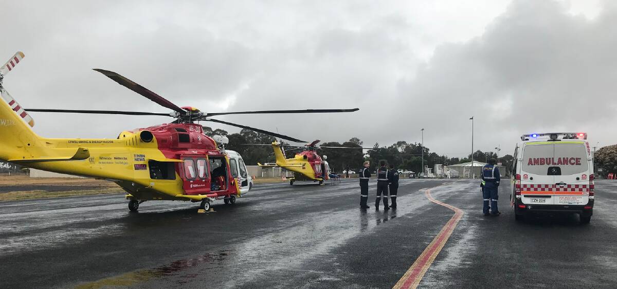 Double mission: The Westpac Rescue Helicopters from Tamworth and Newcastle collected the patients at Armidale Airport. Photo: Westpac Rescue Helicopter Service