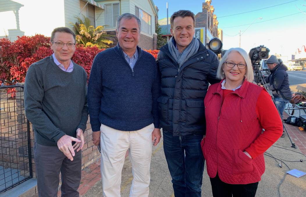 POPULAR: Mayor Simon Murray, second from left, with ABC's Michael Rowland, third, and Guyra locals, Scot and Aileen MacDonald.