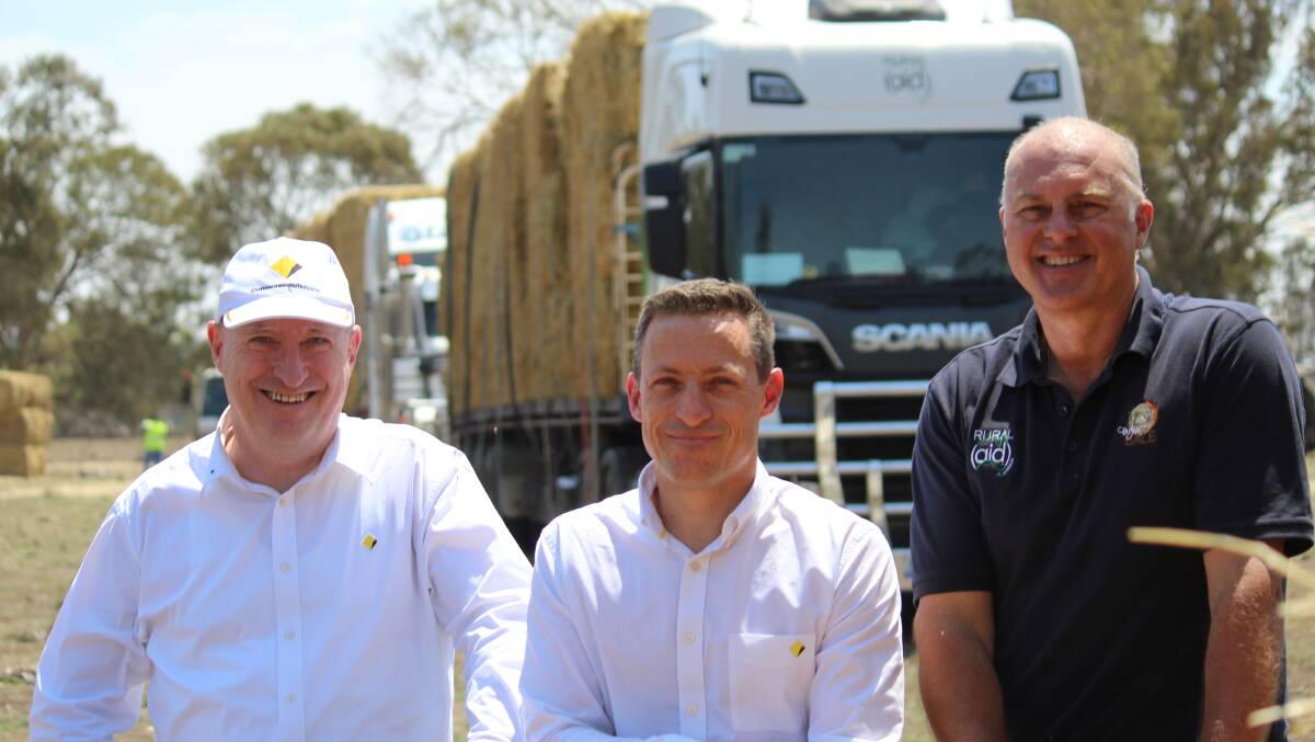 FODDER: Commonwealth Bank representatives Kerry McGowan and Grant Cairns with Craig Marsh from Rural Aid.