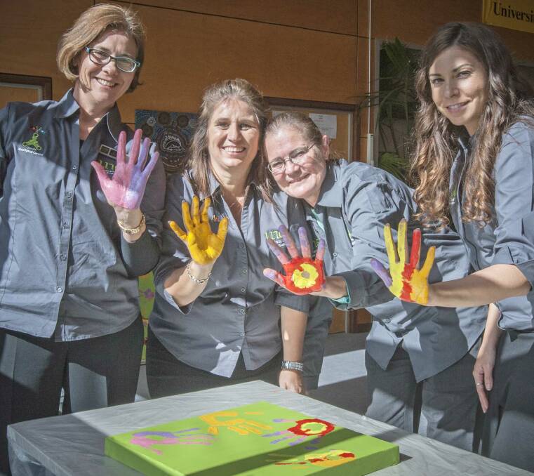 Oorala staff members Kate Carter (l), Tonia Ryan, Donna Moodie and Ms Erin Ferguson during the Sorry Day event.