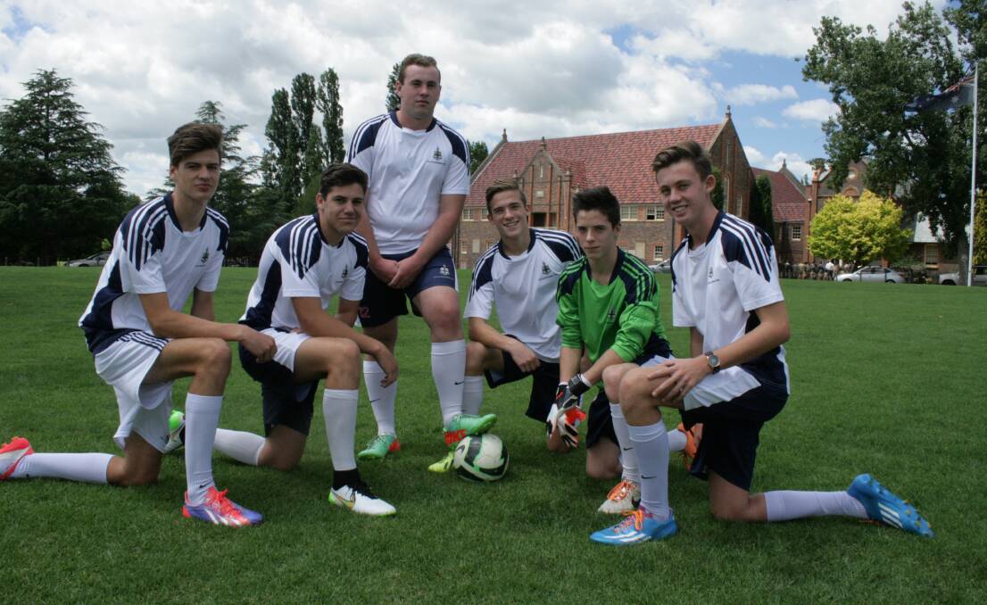 Michael Klepzig (standing with foot on ball) and fellow TAS footballers (from left) Angus Lloyd, Alex Boulus, Euan Spiers, Cai Spiers and Jarrod Bourke will be part of the TAS team which will make its debut in this year’s FFA Cup competition.