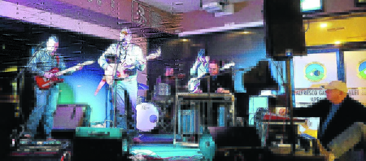 FAVOURITE: Anthony Taylor, second from left, is one of my favourite Australian country singers. He’s pictured at South Tamworth Bowlo with his hot band, from left, Brad Rose (guitar), Paul Novosel (drums), Simon Johnson (bass) and Tomi Graso (pedal steel). At the bottom right you can see Alby Pool.