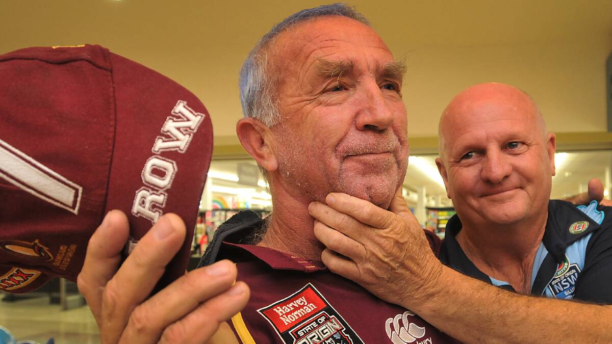 CLEAN CUT: Tamworth man Geoff Watson shows off his freshly-shorn look while good mate Lester Solomons looks on. Mr Watson lost his beard after losing a State of Origin bet. Photo: Geoff O’Neill 250614GOD05