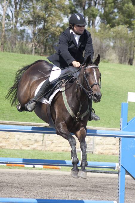 George Johnson and Wondaree Sprite won the 1.25m Sweepstakes class at day one of the Tamworth Winter Indoor Championships. They are aiming for a win in the Sue Alden Memorial Grand Prix on Sunday. Photo:  Furdography