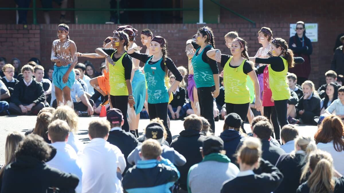ON THE MOVE: The Guumali Dancers added some colour to NAIDOC Week celebrations at Tamworth High yesterday. Photo: Barry Smith 280714BSC25