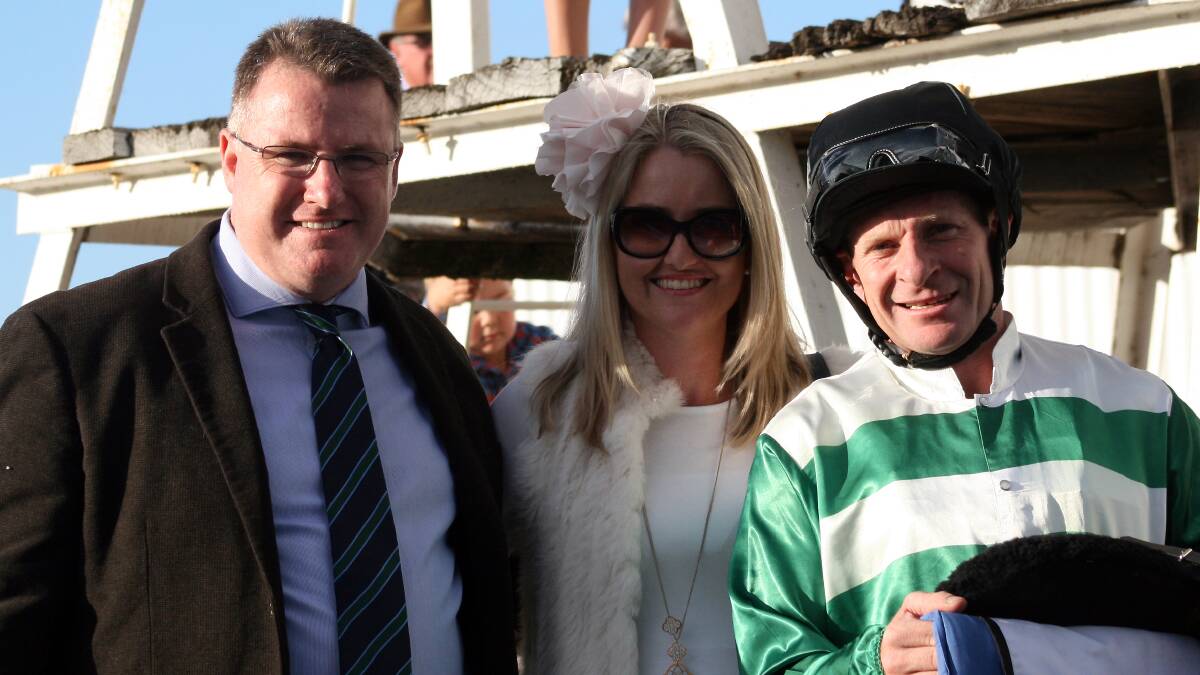 Tapakeg’s part-owners Dominic and Karen Neate with jockey Tim Phillips after winning the Talmoi Cup on Saturday.