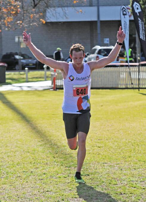SOMEBODY STOP ME: Ben Malby was happy to finish the half-marathon race in first place and backed this performance up with a win in the Fun Five. Photos: Geoff O’Neill 170814GOA02