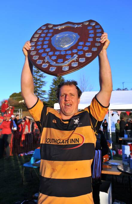 Pirates captain Barton  Leach holds up the shield after beating Walcha in the 2012 grand final. The hooker has hung the boots up as he awaits a third knee reconstruction. Photo: Barry Smith 150912BSD80