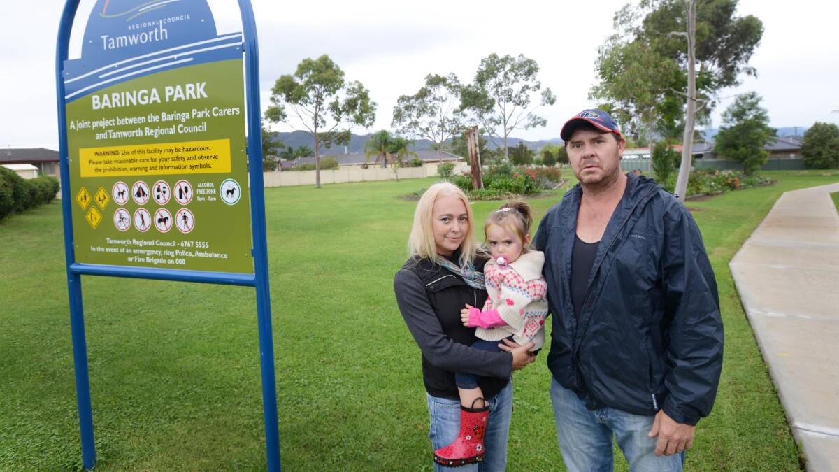 LOW BLOW: Chris Anderson, pictured here with his partner Narelle Doig and their daughter Arlie Joy Anderson, believes council’s decision to remove two garden beds from the community-maintained Baringa Park is poor form. Photo: Gareth Gardner 270314GGH03