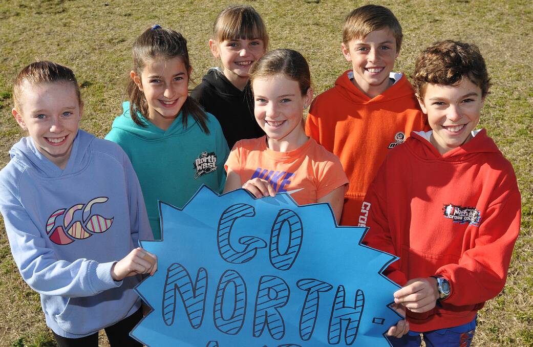 Go North West is the message from these excited young cross country runners preparing for tomorrow’s State All Schools (from left) Sarah Gill, Paige Levingston, Mikaela Bridge, Ella Constable, Joey Mead and Lachlan Wesierski. Photo: Geoff O’Neill 130714GOA01