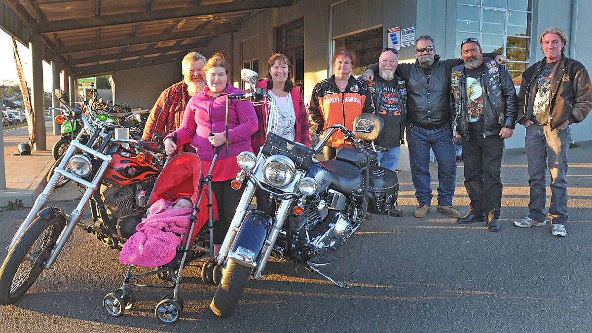 BABY’S PLIGHT TOUCHES RIDERS: Outside The Locomotive Hotel are Allan Jones, left, Michelle Jones with baby Sienna, Gail Jones, Angela Fuller, Peter Fuller, Troy Windle, Stewart Woods and David Partridge. Photo: Geoff O'Neill 260614GOC01