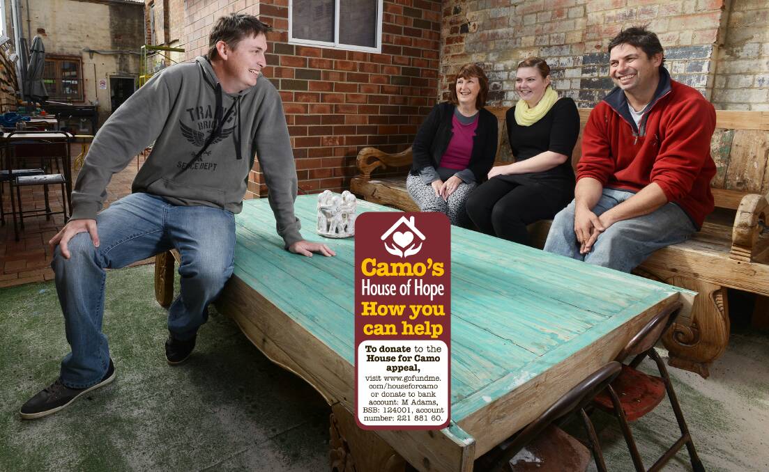 BUILDING HOPE: Teamo Teahouse owner Paul Fisher, right, and waitress Rikki Frankel, middle, with Calala man Cameron Adams, left, and his mum Margie Adams. Teamo will install a plaque for Mr Adams’s late wife Tiffany at her favourite seat in the cafe. Photo: Barry Smith 010714BSB06