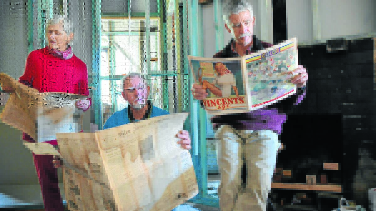 LIVING HISTORY: Surviving fire and the wear of time, The Glen Innes Examiner’s September 10, 1948 edition has been discovered among a treasure trove of trinkets by local renovators Bryce McClenaghan and Bruce and Judy Hannah, who took the opportunity for a reminiscent tea break last week on Meade St. Photo: The Glen Innes Examiner