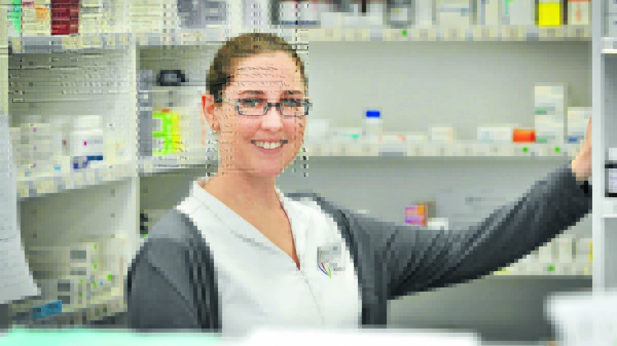 TOP OF THE CLASS: Young pharmacist intern Alyce Northey couldn’t be happier with her chosen career path. Photo: Gareth Gardner 180714GGC02