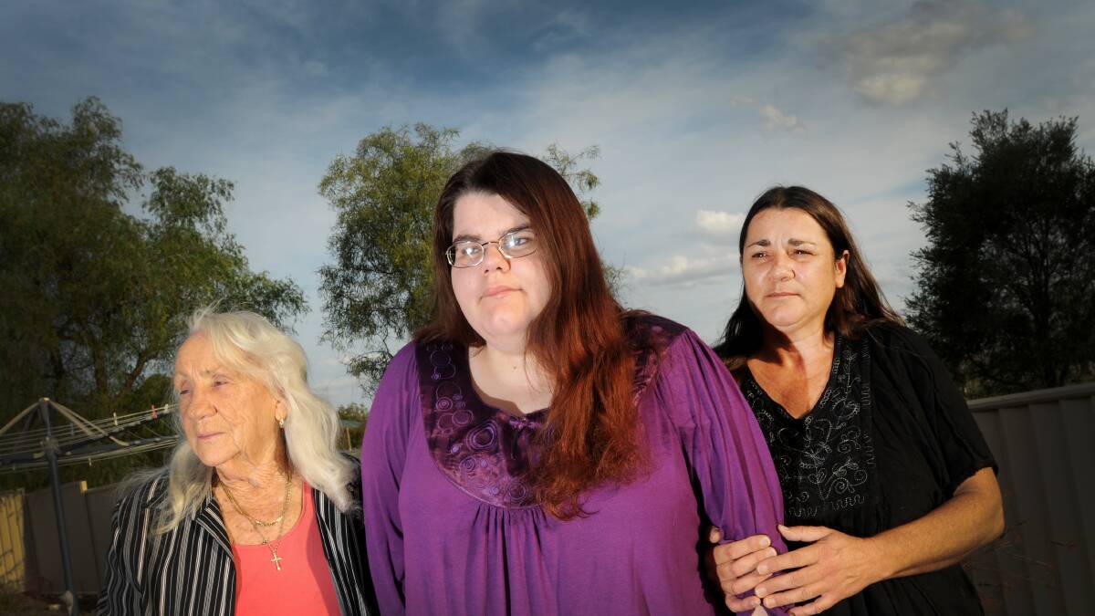 HOPE FLOATS: The Porter family – grandmum Margaret, Annaliese and mum Megan – are hoping the community can help them get back on their feet. Photo: Gareth Gardner 220414GGD02