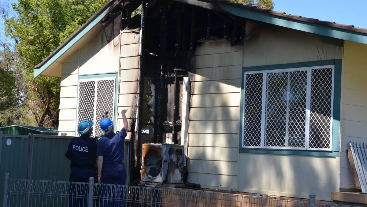PROBE:
Police investigate the Gunnedah home damaged by fire  on the weekend. Photo: 
Namoi Valley Independent
