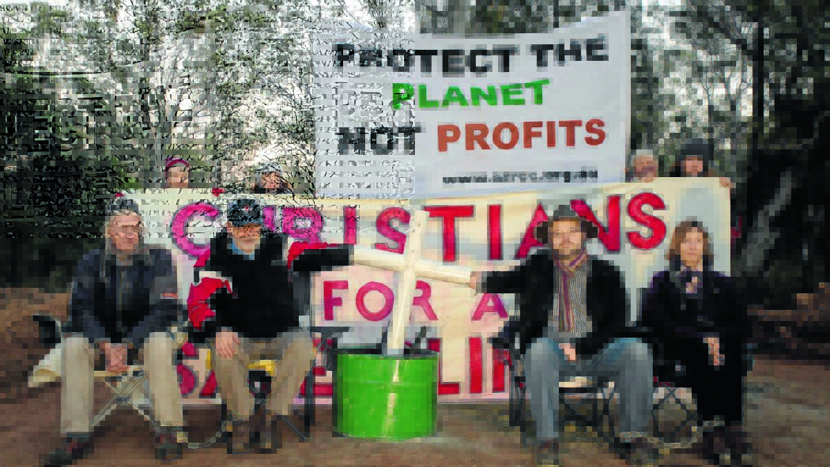 PRAYER POWER: Religious leaders, front from left, Pastor John Carroll, Reverend John Brentnall, lay minister Byron Smith and supporter Gill Burrows stage a peaceful protest in the Leard State Forest.