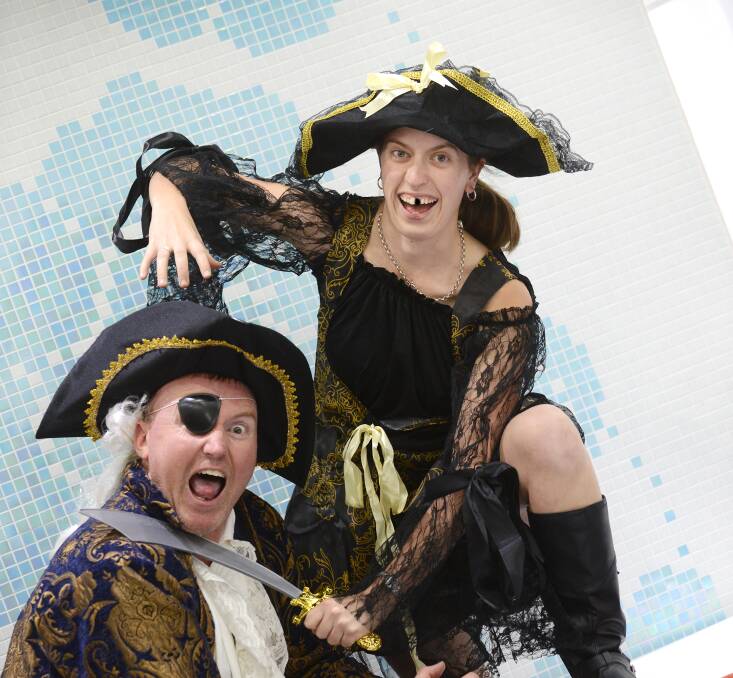 ALL ABOARD: Organiser of a massive pirate-inspired fundraising ball in Tamworth next month, Kevin Attard, and his ‘pirate wench’ Stephanie 
Walters get into the spirit ahead of the much-
anticipated event. 
Photo: Barry Smith 270214BSD02