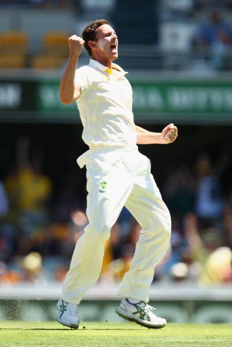 Josh Hazlewood pumps the air after getting Virat Kohli to edge one behind for his second wicket. Photo: Getty