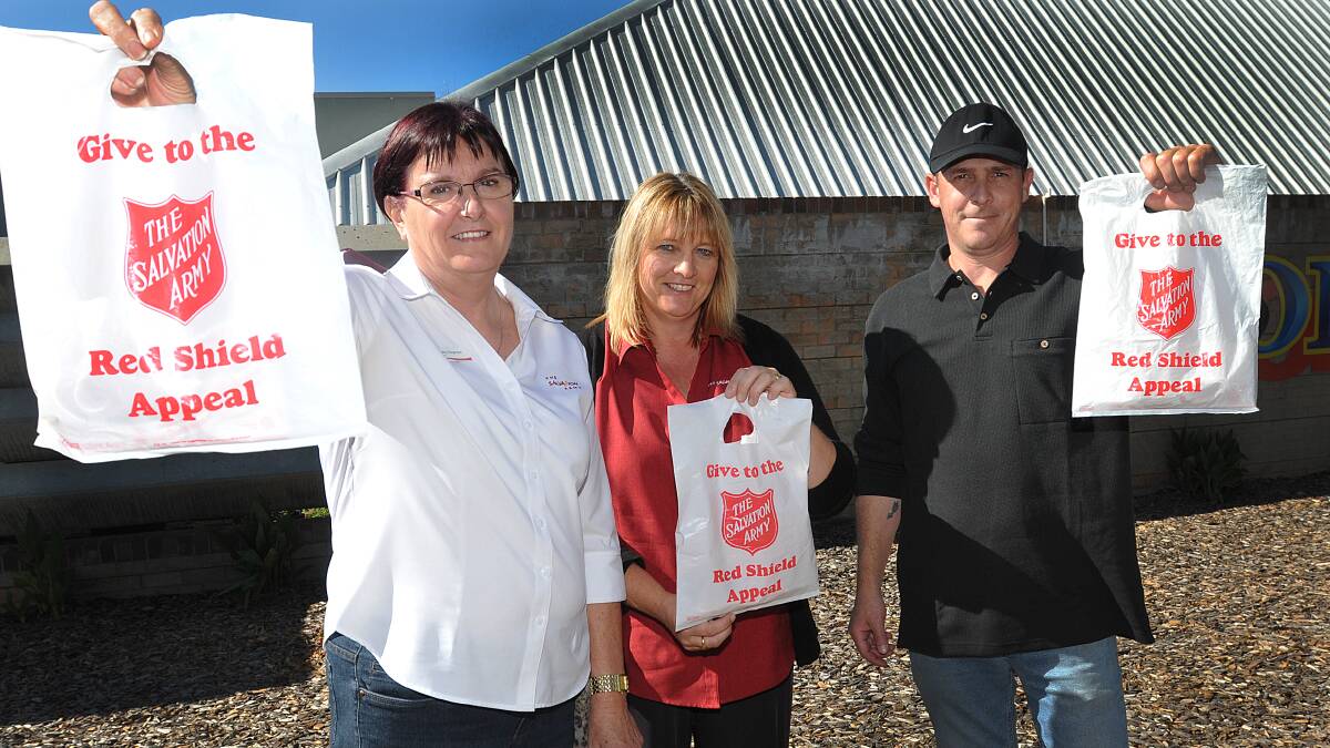 GIVING WEEKEND: From left, Salvation Army Major Cathy Rogerson, Kathy Kinnane and Jason Whalley will be out fundraising for the Red Shield Appeal this weekend. Photo: Geoff O’Neill 220514GOA01