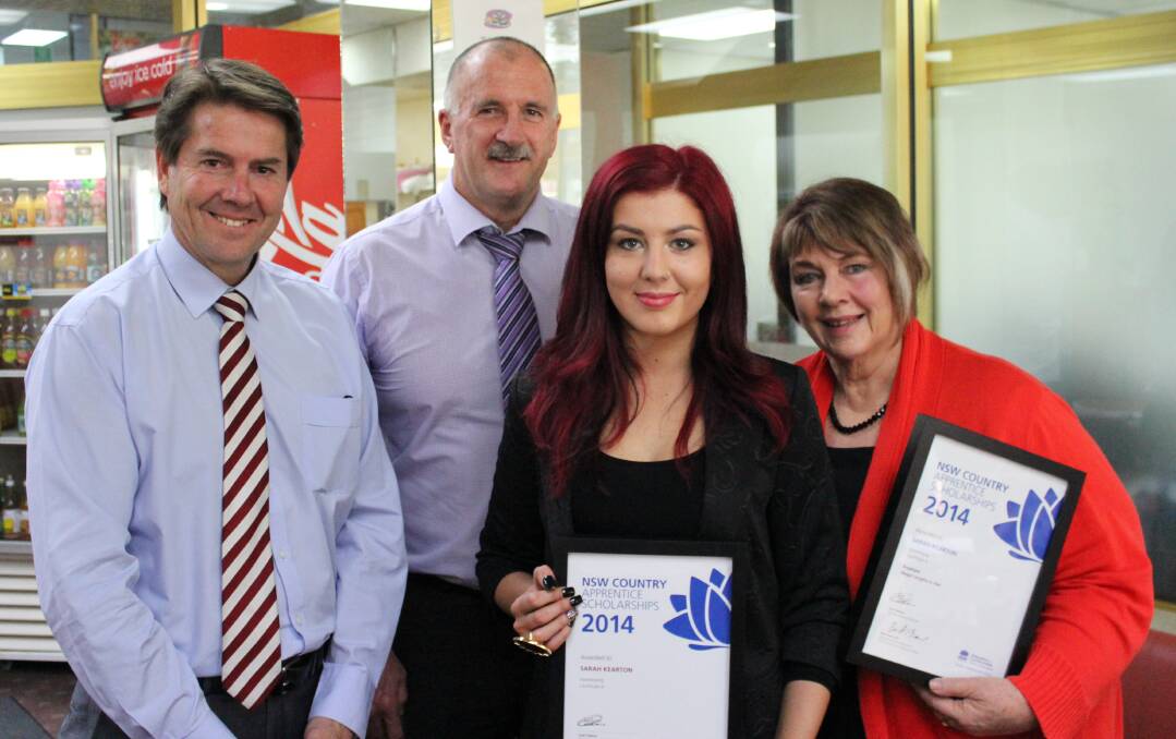 CUT ABOVE: Tamworth MP Kevin Anderson, regional manager of State Training Services Greg Poetschka and Illegal Lengths in Hair owner Chene Hardman, right, congratulate local hairdresser Sarah Kearton on receiving a prestigious scholarship this week.