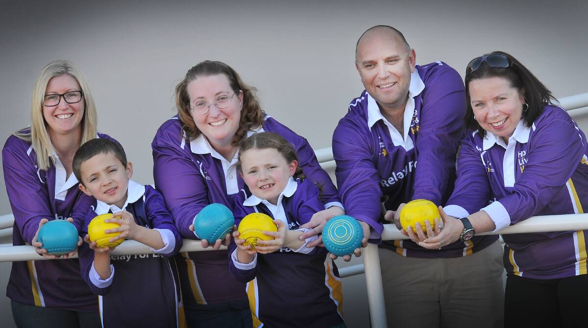 GET RELAY ROLLING: Cancer Council’s Sue-Ellen Hogan, Relay for Life committee members Sheri Ware, Don Murphy, Collette McLaren and children Reece and Hailey Ware are ready for the barefoot bowls Relay for Life launch. Photo: Gareth Gardner 080814GGD01