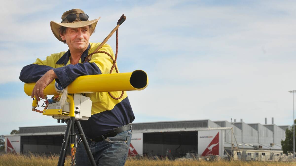 STRIKING BACK: Tamworth Regional Council airport reporting officer Len Klumpp with his stockwhip and bird cannon. Photo: Gareth Gardner 301014GGG01