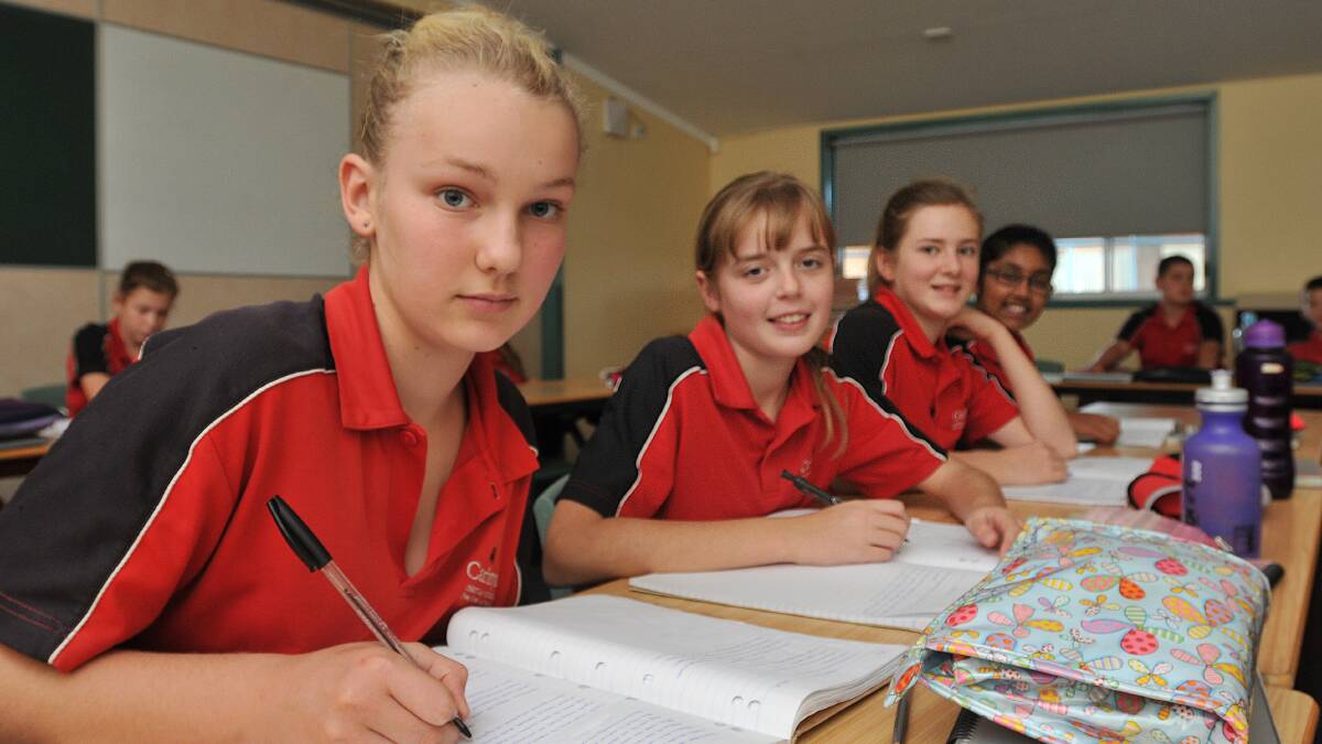 STUDYING HARD: Carinya Year 7 students, from left, Katelin De Roover, Zara Marshall, Georgia Feuilherade and Impana Dayananda are among thousands of students from around the region sitting NAPLAN tests this week. Photo: Geoff O’Neill 120514GOD02