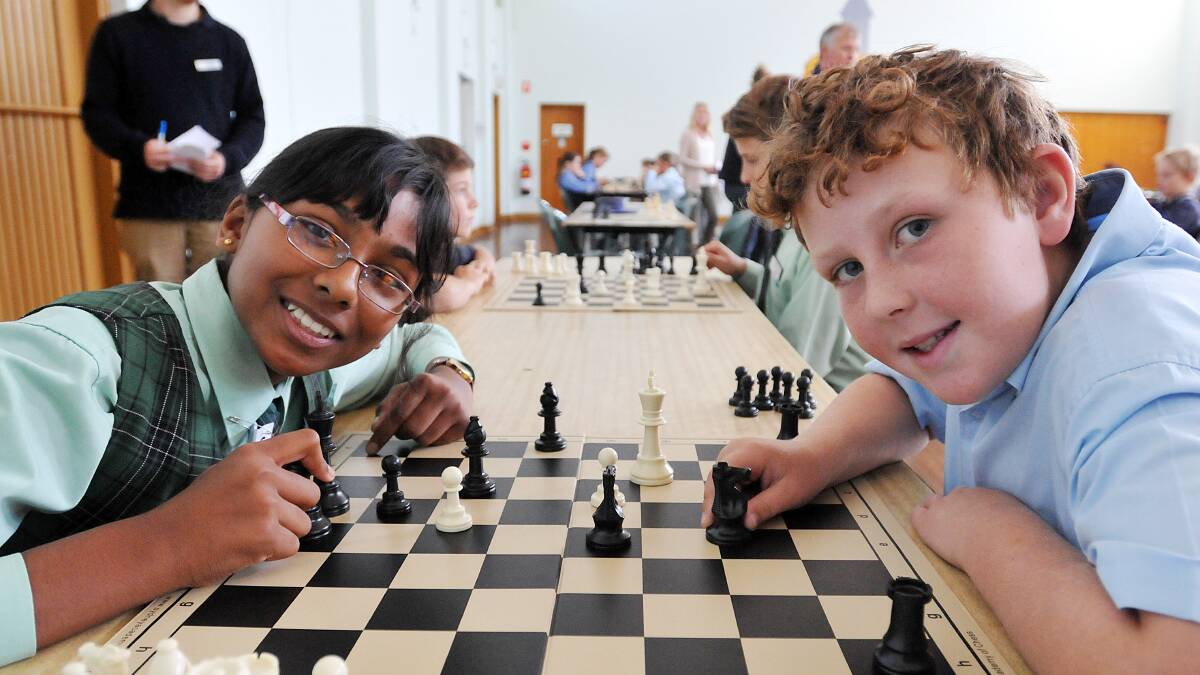 CHECK-MATES: Imeshi Dayapatne, of St Nicholas’ Primary and Bailey Young, St Edward’s primary, do battle in the inter-school chess competition in Tamworth last week. Photo: Geoff O’Neill 160514GOC04