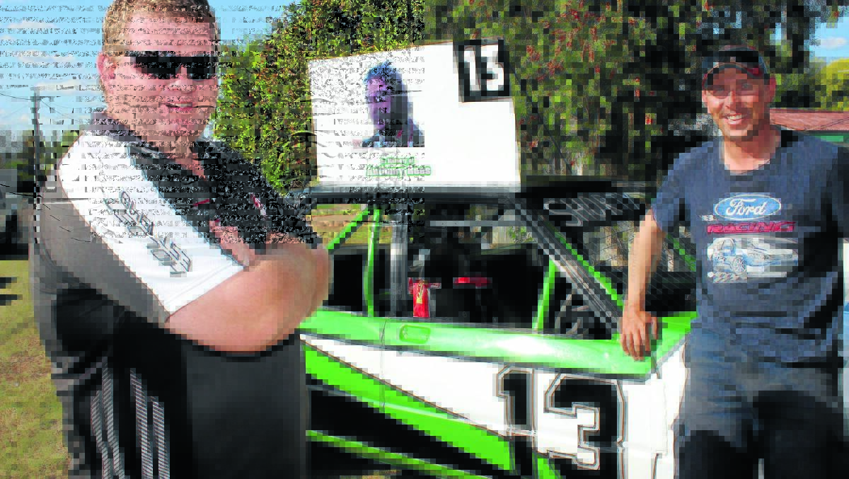 HONOURING A MATE: Anthony Rees’ brother David and Anthony’s best mate Glen McArthur with the tribute car Glen will race tonight in the inaugural Anthony Rees Memorial at the Gunnedah Speedway.