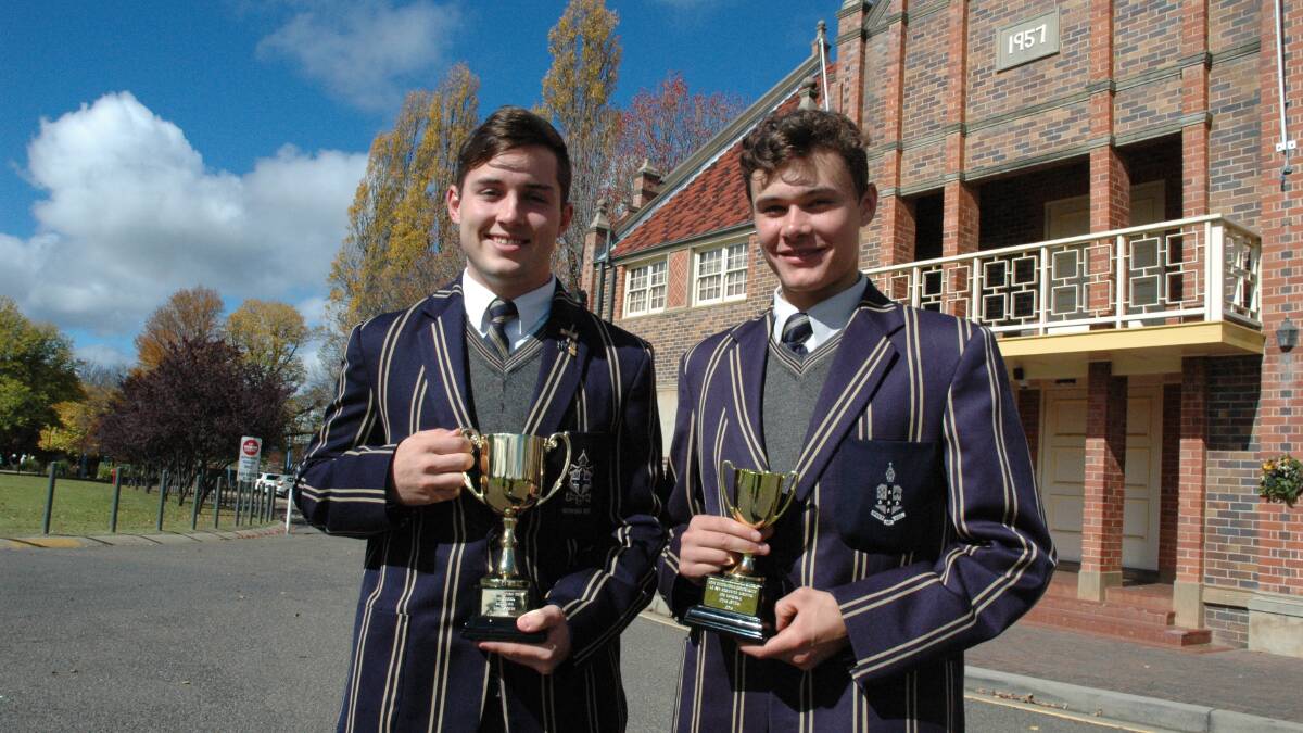 TAS Athletics captain Ben Broster (left) was presented with an award for his contribution to the sport, and Joe Makeham with the inaugural trophy for best performance by a TAS athlete at the annual GPS athletics competition.