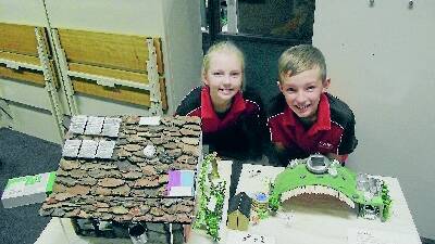 STUDENTS GETTING SUSTAINABLE: Sarah, 11, and Caleb McIlveen, 9, of Carinya Christian School brought in their Green House Project entries to the North West Local Land Services office last month.
Photo: Col Easton