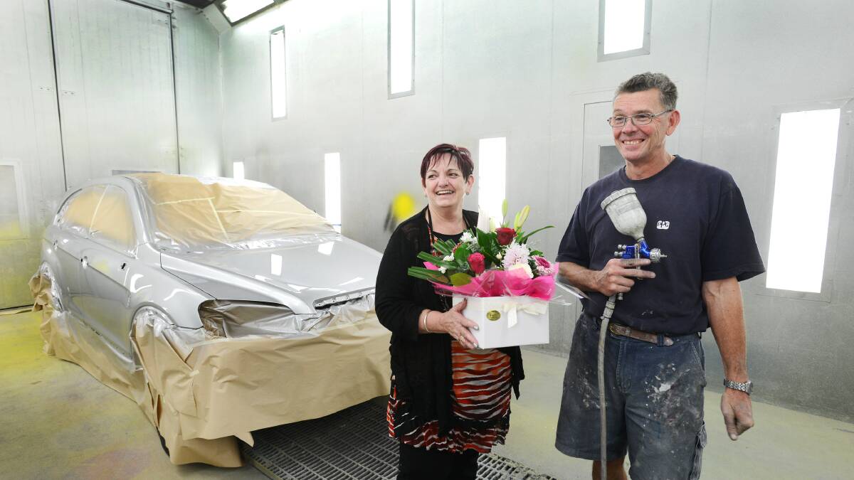 WORKPLACE LONGEVITY: Nyman’s Smash Repairs employees Cheryl Delbridge and Brian Sipple have each notched up 30 years of service with the company. Photo: Barry Smith 230504BSC03
