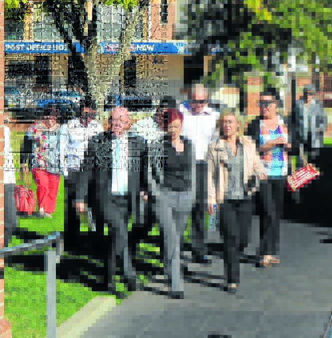 CHARGES DENIED: Hilton Humphries, pictured left, walking into Moree Local Court yesterday morning flanked by supporters. Photo: Laini Kirkman, Moree Champion