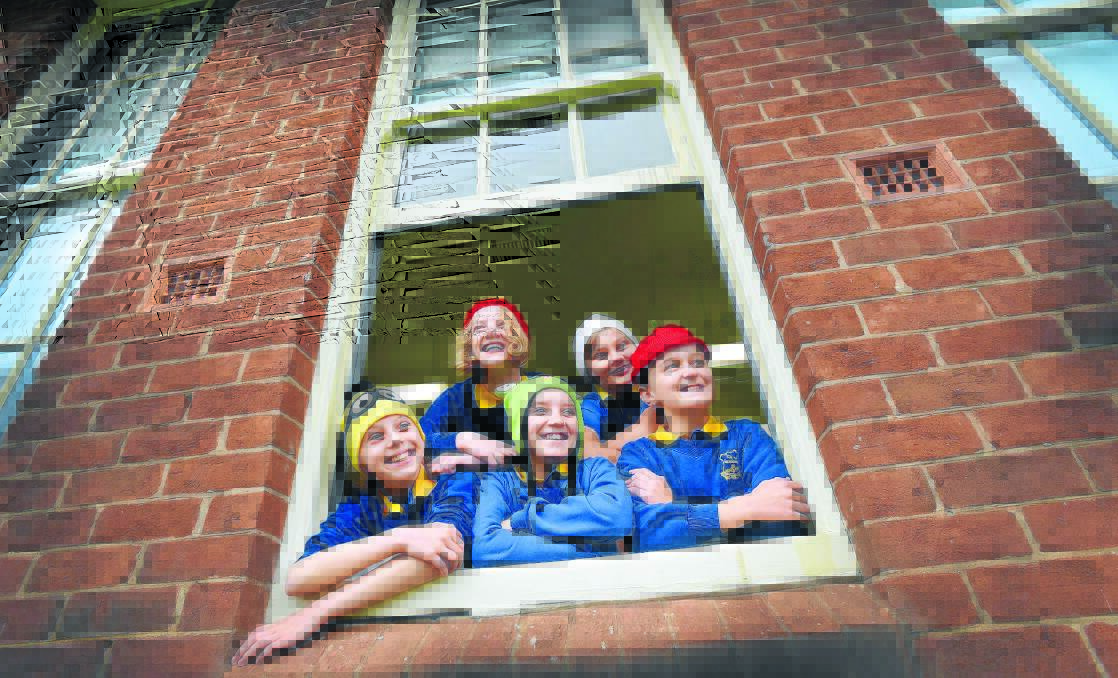 USING THEIR NOODLES: Beanies for Brain Cancer Day at Tamworth Public School supported by, back, Year 6 students Jazmin Lissarrague and Clayton Sagar, and front, Year 5 student Samantha Dustin with Year 6 pupils Chelsea Emery and Amelia Loseby, modelling their headwear for a good cause. Photo: Gareth Gardner 220515GGA02