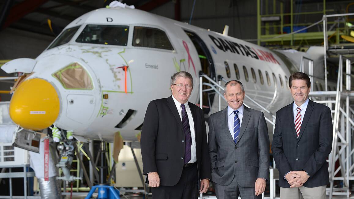 FLYING HIGH: Tamworth mayor Col Murray, 
QantasLink chief executive officer John Gissing and Tamworth MP Kevin Anderson hail the expansion of the airline’s maintenance facility as a huge boost to the local economy. Photo: Barry Smith 040914BSA09