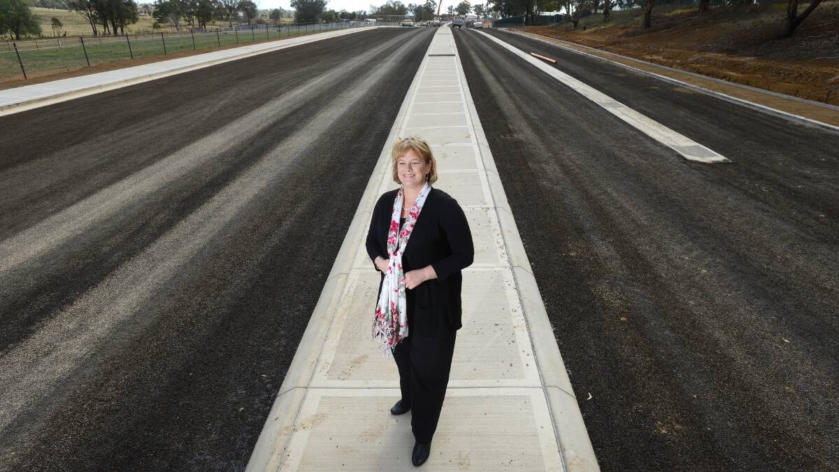 ROAD TO SOMEWHERE: Tamworth Regional Council’s Jackie Kruger casts her eye over the Cole Rd extension project. Cole Rd will no longer be a dead end when it opens to traffic on Monday following extensive roadworks. Photo: Barry Smith 250714BSB03