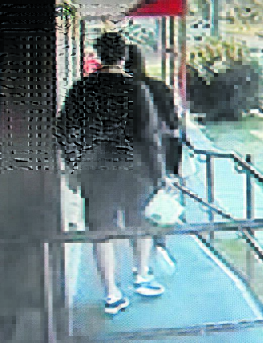 CCTV footage shows a man walking in empty-handed and then walking out with the bucket.
